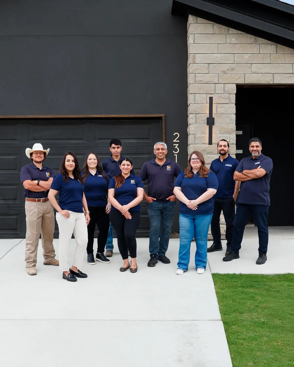 Shiny Homes team in front of a custom-built home